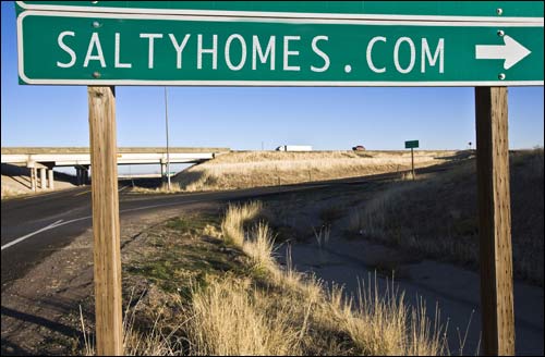 Freeway exit sign pointing to saltyhomes.com